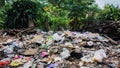 Background of garbage. Piles of undecomposed garbage. Plastic garbage fills the yard. The concept of environmental pollution Royalty Free Stock Photo