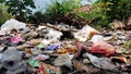 Background of garbage. Piles of undecomposed garbage. Plastic garbage fills the yard. The concept of environmental pollution Royalty Free Stock Photo