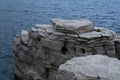 Piles of unique white rocks in the form of blocks arranged like stairs on the shores