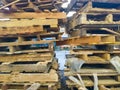 piles of wooden pallets that cannot be used because they are dirty and damaged Royalty Free Stock Photo