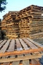 piles of wooden pallets, for industrial needs as a medium for packing goods Royalty Free Stock Photo