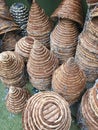 Piles of Woven baskets in brown with silver chains