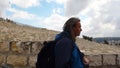 Pilgrim with backgorund on Panoramic view on the Jewish Cemetery, Mount from Mount of Olives, Jerusalem, Israel