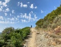 Pilgrim climbing a mountains along the Camino de Santiago, Spain.