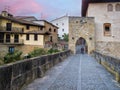 Pilgrim crossing the medieval bridge of Puente la Reina, in the Way of Saint James, Spain Royalty Free Stock Photo