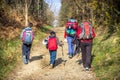 Pilgrim Family Adult and Children Hiking with Backpack Gear along the Pilgrimage Trail Way of St James - Camino de Santiago Jakob