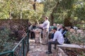 Pilgrim group does group prayer in The Garden Tomb Jerusalem located in East Jerusalem, Israel