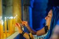 Pilgrim lighting a candle, Orthodox Good Friday, Holy Sepulchre church