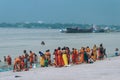 Pilgrim People are taking bath at the riverbank of the Ganges or river Hooghly . Babu Ghat, Kolkata, West Bengal, India. August 2