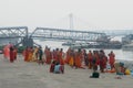 Pilgrim People are taking bath at the riverbank of the Ganges or river Hooghly . Babu Ghat, Kolkata, West Bengal, India. August 2