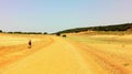 Pilgrim on Santiago`s walk. Yellow fields