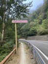 Pilgrim sign on the walking path beside the road in the Camino de Santiago, Spain.