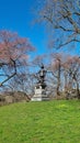 Pilgrim Statue at the Central park surrounded by sakura blossoms