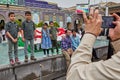 Pilgrim takes pictures of Iranian children near mosque, Tehran,