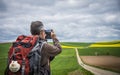 Pilgrim taking pictures on the road to Santiago Royalty Free Stock Photo