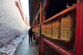 Pilgrim turning Prayer Wheels in Ramoche Temple Royalty Free Stock Photo