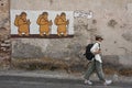 Pilgrim walking along the Via Francigena near Terracina, in the province of Latina Italy. Mature woman with backpack on the road