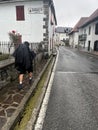 Pilgrim walking through Burguete Auritz