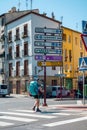 Pilgrim walking the Camino de Santiago next to a street signage