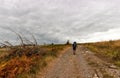 Pilgrim walking on the path of Way of St James called Chemin du Puy, France