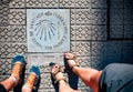 Pilgrimage at the Camino de Santiago. Sign shells and yellow arrow for piligrims on Way of St James, Camino de Santiago de Royalty Free Stock Photo