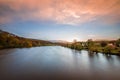 Pilgrimage church Mariaort and the river Naab near Regensburg during a dramatic sunset and clouds after a thunderstorm storm, Germ Royalty Free Stock Photo