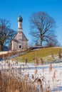 Pilgrimage church Ramsach, near Murnau, blue sky and rests of snow, vertical