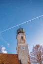 Pilgrimage Church Wallfahrtskirche Heiligenstatt in Tussling, Germany. Airplane contrails on blue sky Royalty Free Stock Photo