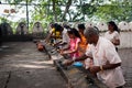 Pilgrimagers ignite coconut oil lamps