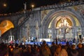 Pilgrims attend the Marian Torchlight Procession service at the Rosary Basilica in Lourdes Royalty Free Stock Photo