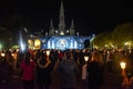 Pilgrims attend the Marian Torchlight Procession service at the Rosary Basilica in Lourdes Royalty Free Stock Photo