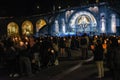 Pilgrims attend the Marian Torchlight Procession service at the Rosary Basilica in Lourdes Royalty Free Stock Photo