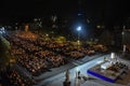 Pilgrims attend the Marian Torchlight Procession service at the Rosary Basilica in Lourdes Royalty Free Stock Photo