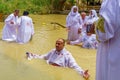 Pilgrims baptize in Qasr el Yahud Royalty Free Stock Photo