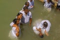 Pilgrims baptizing in the Jordan River, in the Yardenit Baptismal Site. Northern Israel Royalty Free Stock Photo