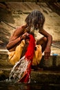 Pilgrims bathe and wash in the holy waters of the Ganges, Varanasi, India