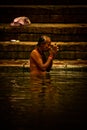 Pilgrims bathe and wash in the holy waters of the Ganges, Varanasi, India