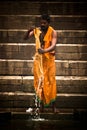 Pilgrims bathe and wash in the holy waters of the Ganges, Varanasi, India