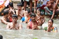 Pilgrims bathing in river