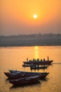 Pilgrims on boat floating on the waters of sacred river Ganges early morning. Royalty Free Stock Photo