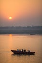 Pilgrims on boat floating on the waters of sacred river Ganges early morning. Royalty Free Stock Photo