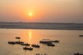 Pilgrims on boat floating on the waters of sacred river Ganges early morning. Royalty Free Stock Photo