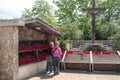 Pilgrims, candles and Holy cross