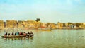 Pilgrims enjoying early sunrise boat ride on Ganga/Ganges river in Varanasi, India