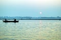 Pilgrims floating by boat of the sacred Ganges river. Sunrise in Varanasi. Uttar Pradesh, India Royalty Free Stock Photo