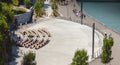 Pilgrims gather on the benches in front of the Grotto of Lourdes Royalty Free Stock Photo