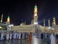 Pilgrims gather at night in the outer courtyard of Masjid Al Nabawi, Madinah.