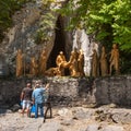 Pilgrims lighting candles before sculptural composition of the episode burial of the body of Jesus Christ after crucifixion, the S