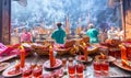 Pilgrims queue bustling temple incense New Year Day Royalty Free Stock Photo
