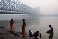 Pilgrims at river Ganges under Howrah bridge Royalty Free Stock Photo